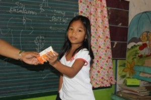 a student receives her vitamins