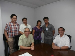 scholar with board members