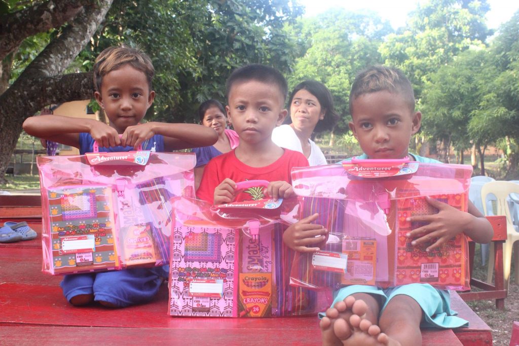 Students receiving their school supplies