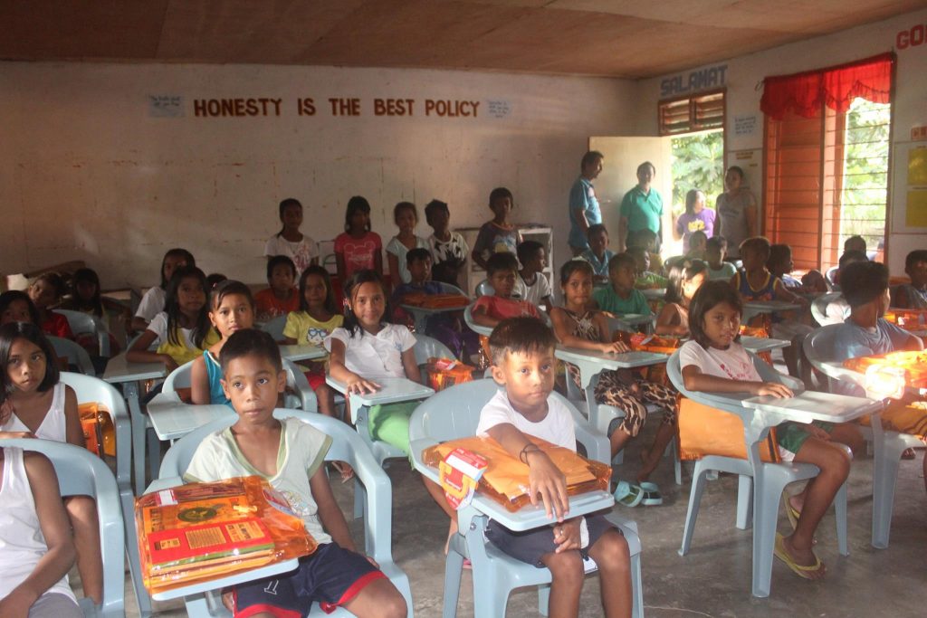 students in their new school chairs