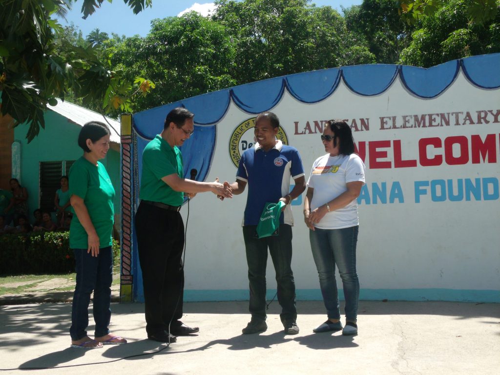 JD Pamana President turnsover the school supplies to Landusan Elementary School Principal, Mr. Ramir Castillo